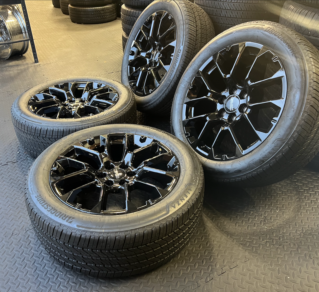 OEM 22” Gloss Black 6-Split-Spoke Replica Wheels wrapped in Bridgestone tires.