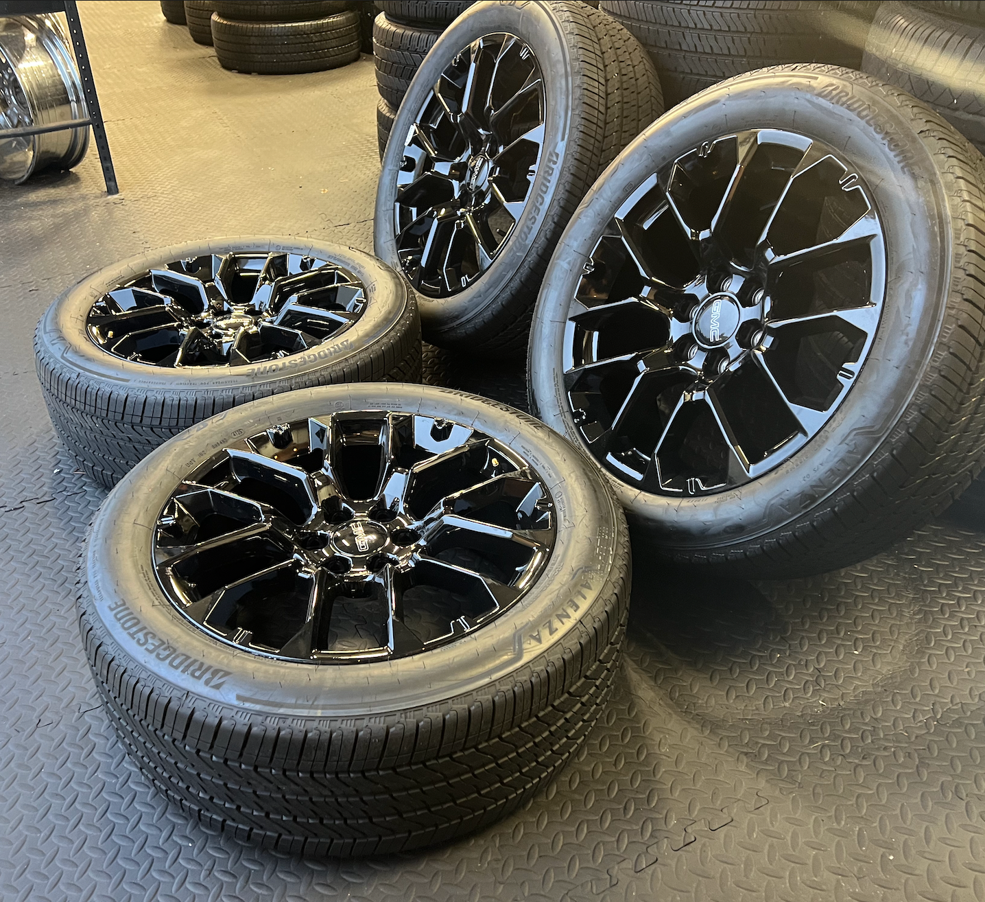 OEM 22” Gloss Black 6-Split-Spoke Replica Wheels wrapped in Bridgestone tires.