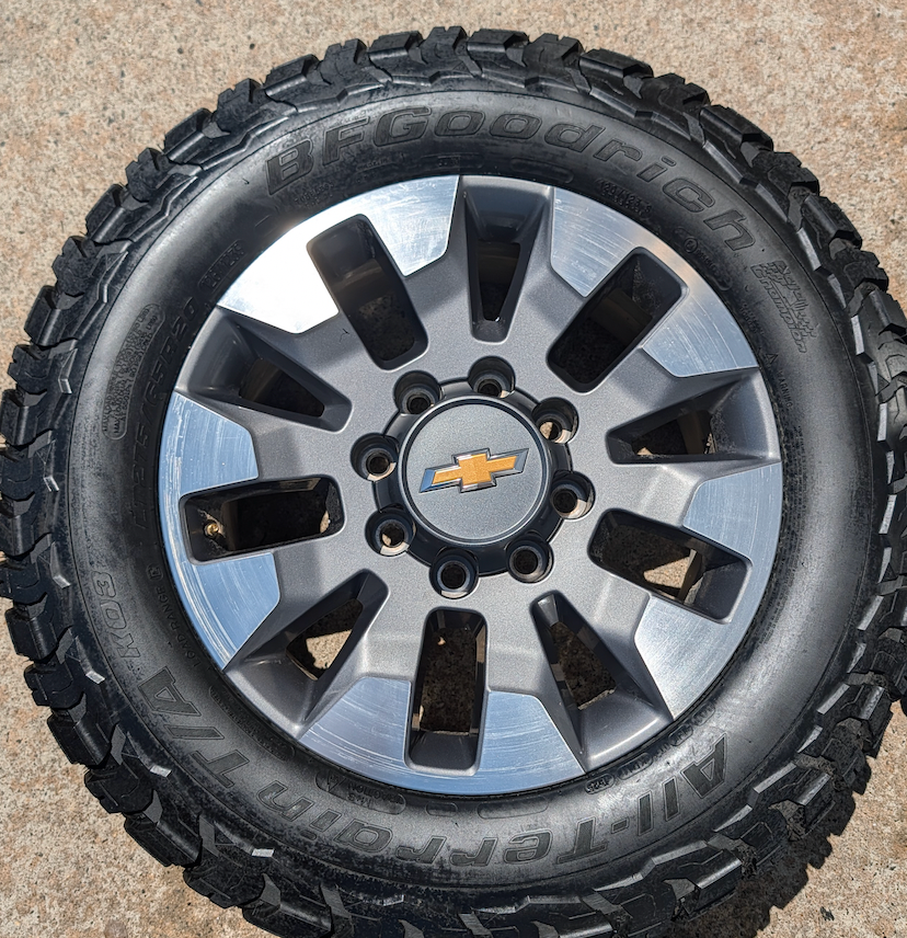 OEM 20” Chevrolet Silverado 2500HD / 3500HD Wheels with Machined Grey Finish wrapped in LT275/65R20 BFGoodrich All-Terrain T/A KO3 tires.