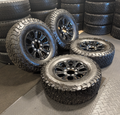 OEM 18” Ford F-250 / F-350 Tremor Wheels with Gloss Black Finish wrapped in BFGoodrich All-Terrain T/A KO3 tires.