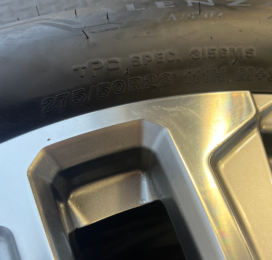 OEM 22” Denali Wheels with Machined & Grey Finish wrapped in Bridgestone tires.