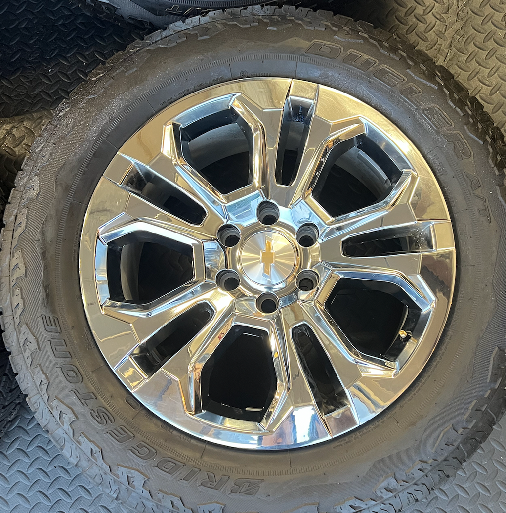 OEM 20” Chrome Wheels wrapped in Bridgestone Dueler tires.