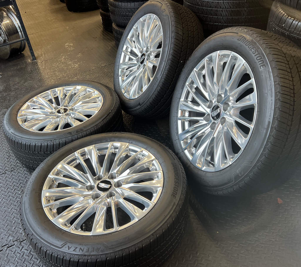 OEM 22” Polished Aluminum Wheels wrapped in Bridgestone tires.