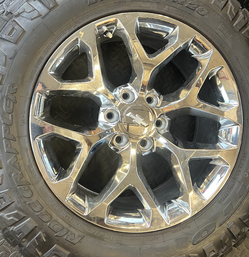 OEM 20” Chrome Truck Wheels wrapped in Nitto Ridge Grappler tires.