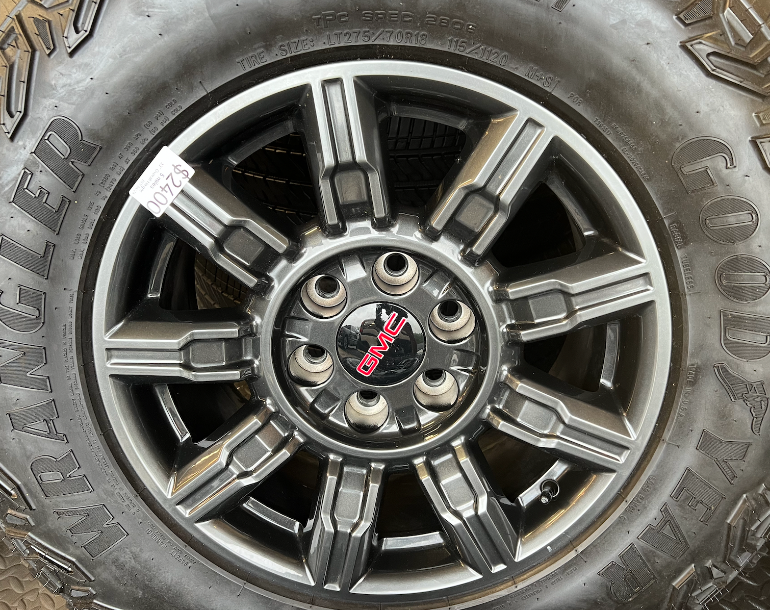 OEM 18" at4x machined aluminum Wheels wrapped in Goodyear tires.