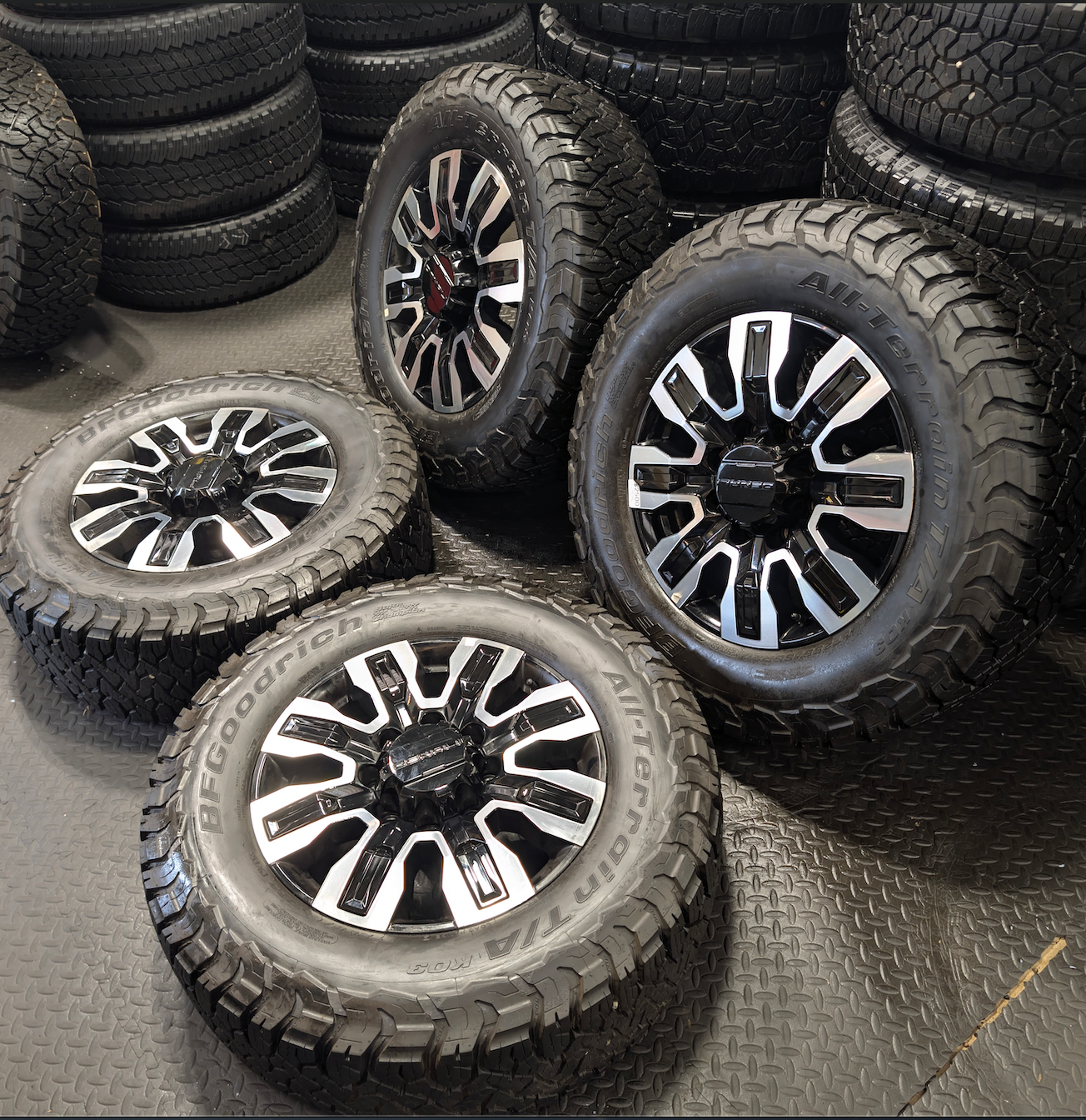OEM 20” GMC Sierra Denali Ultimate 2500HD / 3500HD Machined Wheels wrapped in BFGoodrich All-Terrain T/A KO3 tires.