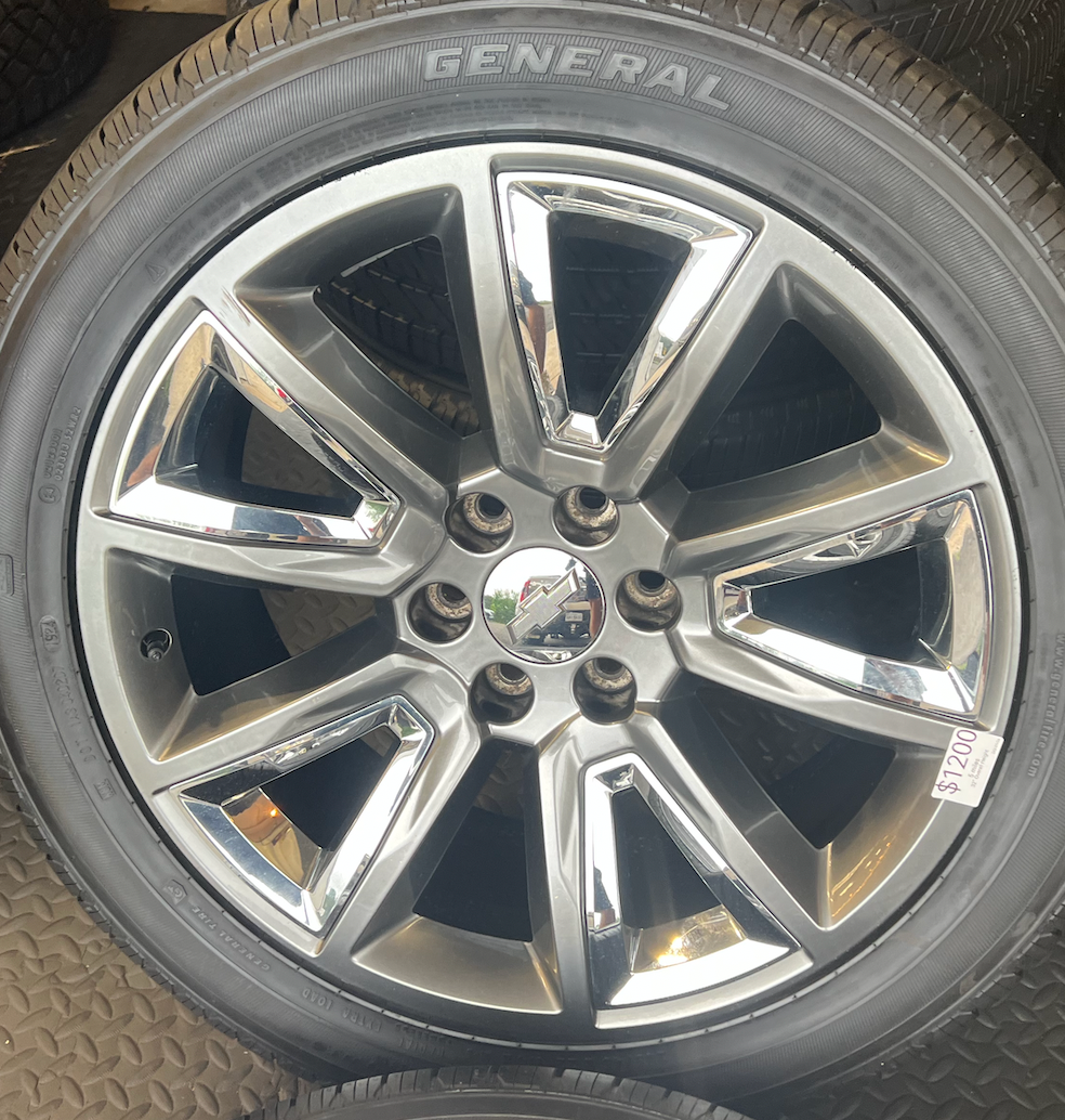 OEM 22” Wheels with Hypersilver Finish & Chrome Inserts wrapped in General Grabber tires.