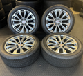 OEM 22” Denali Wheels with Machined & Grey Finish wrapped in Bridgestone tires.
