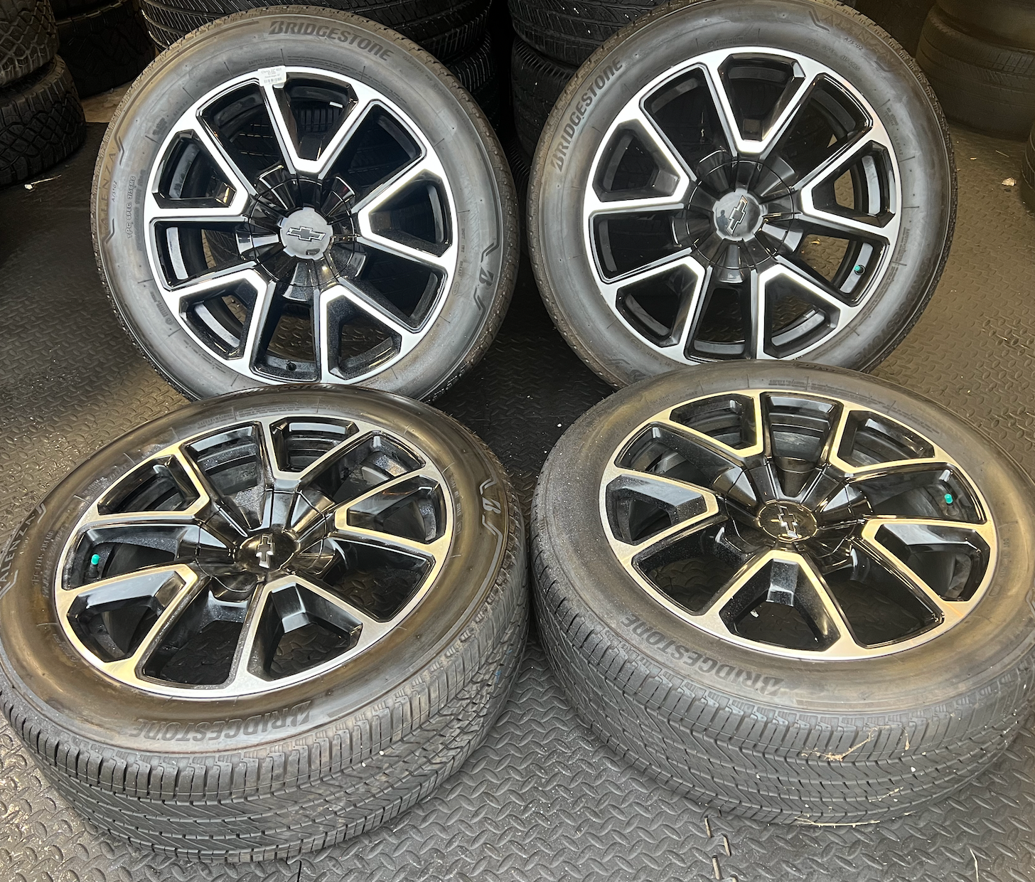 OEM 22” Black Machined Chevrolet Tahoe/Suburban Wheels wrapped in Bridgestone tires.