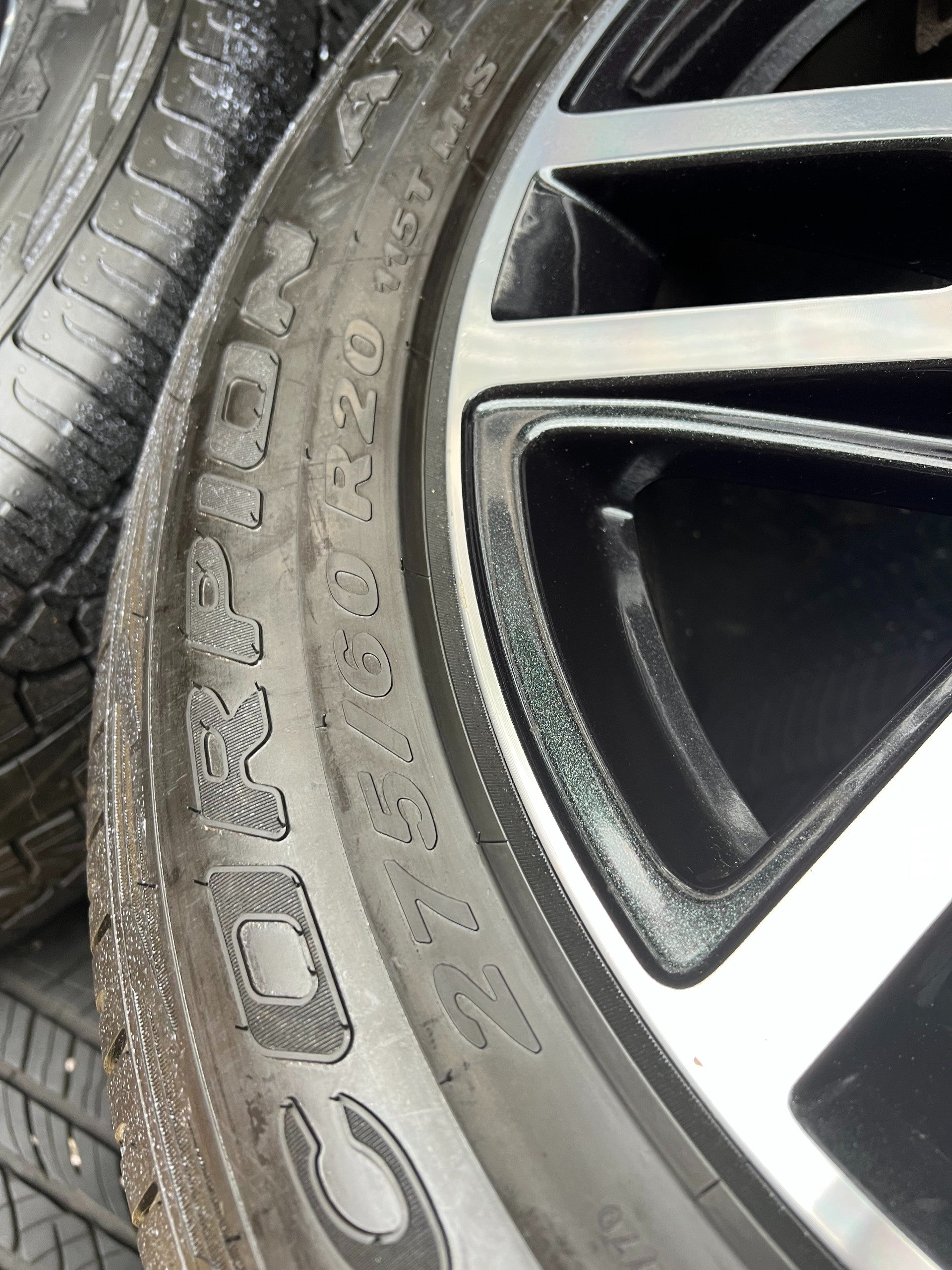 OEM 20” Gloss Black Wheels with Silver Inserts / Accents wrapped in 275/60R20 Pirelli Scorpion A/T tires.