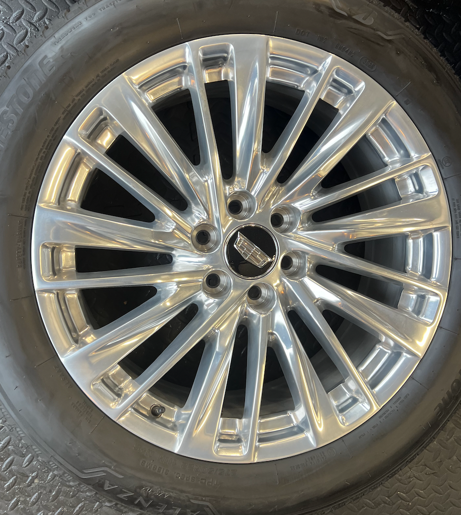 OEM 22” Polished Aluminum Wheels wrapped in Bridgestone tires.