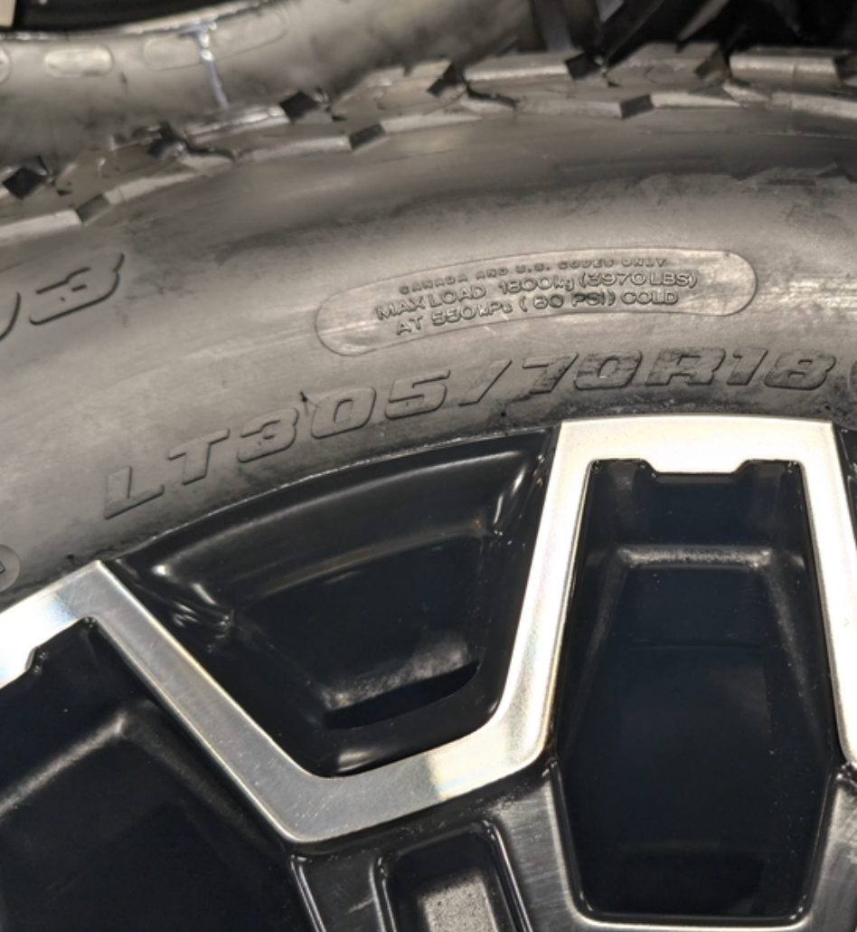Machined Black GM 2500HD / 3500HD OEM 18” Wrapped in BFGoodrich All-Terrain T/A KO3 LT305/70R18