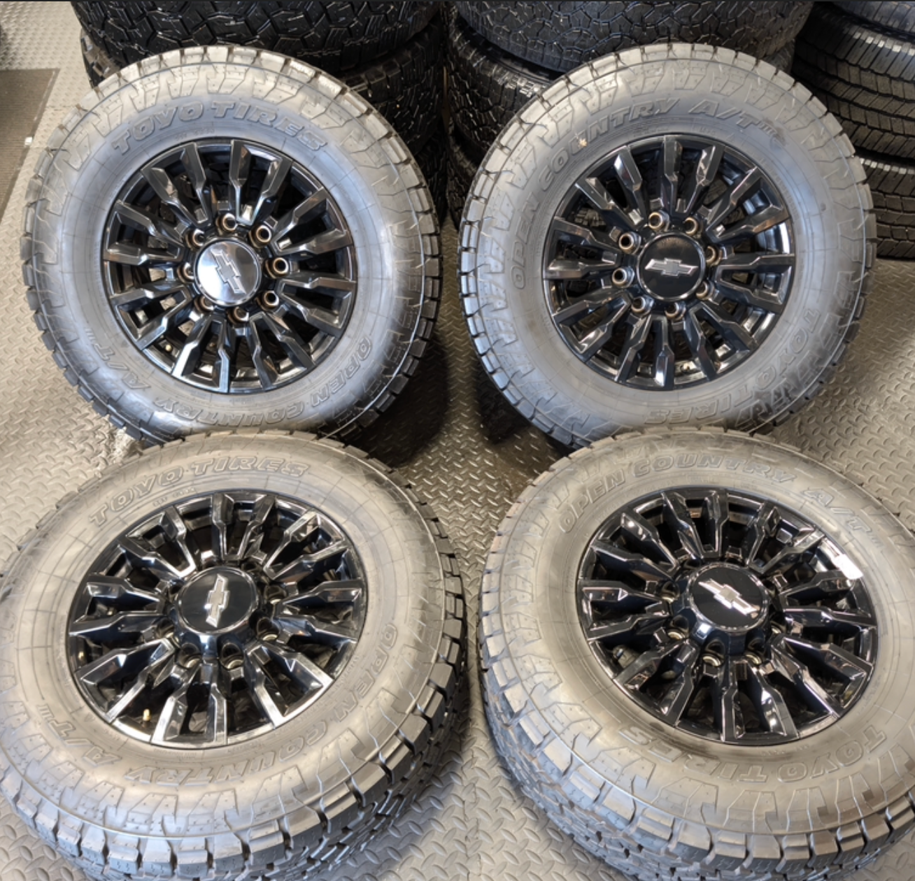 OEM 18” Chevrolet Silverado ZR2 2500HD / 3500HD Gloss Black Wheels wrapped in Toyo Open Country A/T tires.
