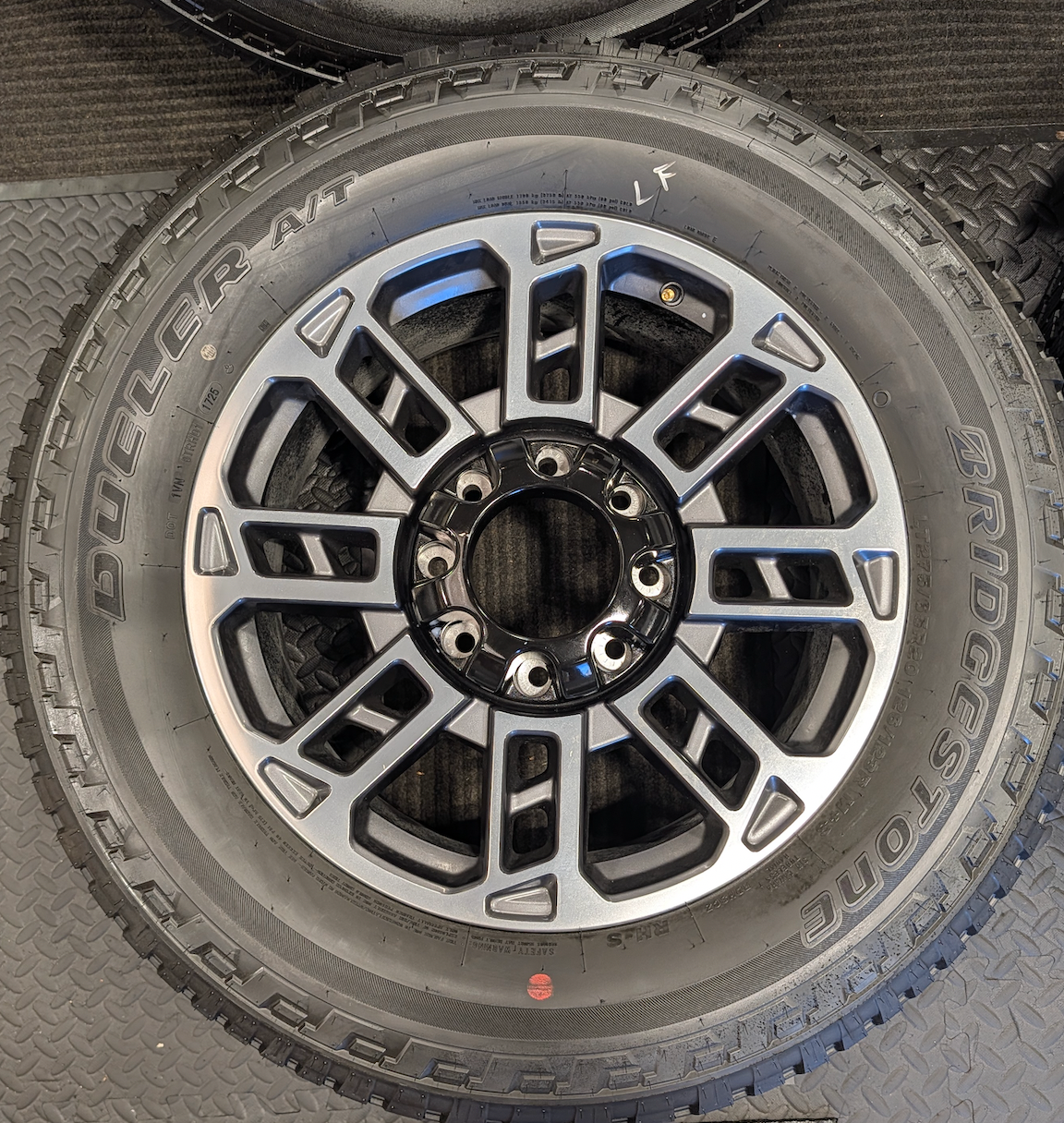 OEM 20” Ford Limited / Platinum Wheels wrapped in Bridgestone Dueler tires.