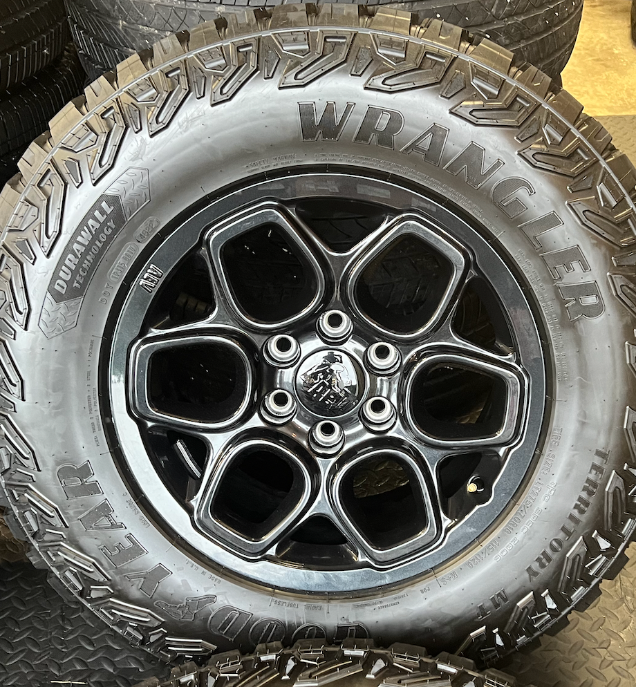 OEM 18”  Wheels wrapped in Goodyear Wrangler Territory M/T tires.