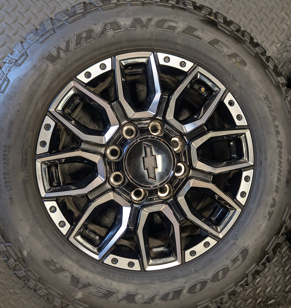 OEM 20” Machined GM 2500HD / 3500HD Wheels wrapped in Goodyear Wrangler TrailRunner A/T tires.