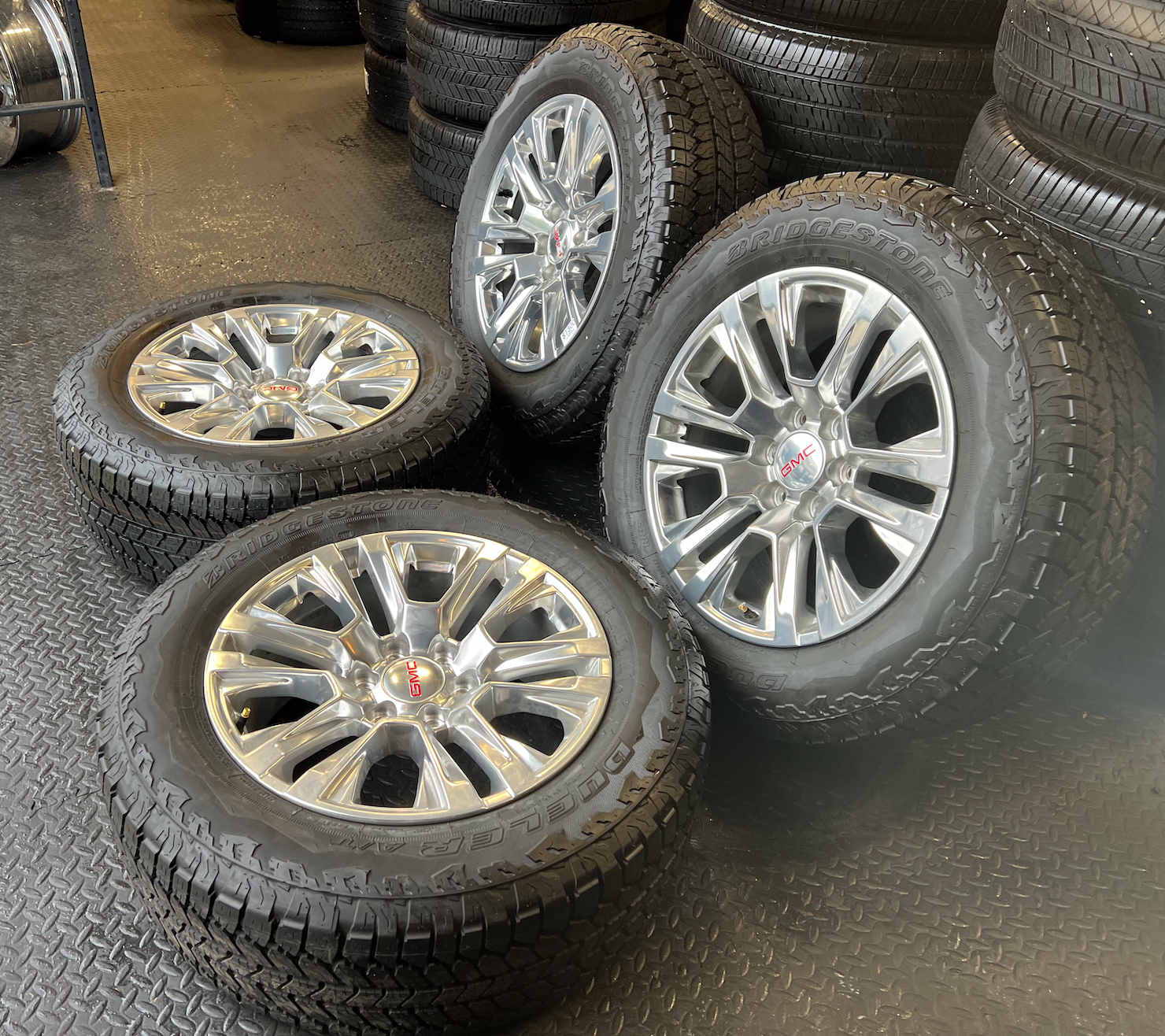 OEM Rebuilt 20” Polished Wheels wrapped in Bridgestone Dueler tires.