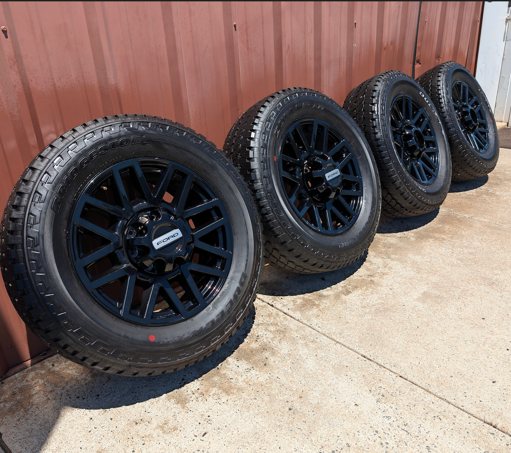 OEM 20” Chevrolet Silverado RST Gunmetal & Machined Wheels wrapped in Goodyear Wrangler TrailRunner A/T tires.