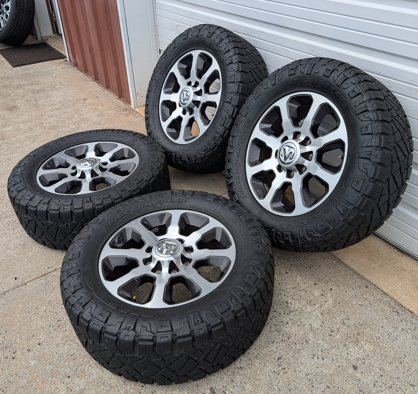 Machined Ram 2500 / 3500 OEM 20” Wrapped in Nitto Ridge Grappler LT295/60R20