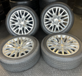 OEM 22” Polished 6-Split-Spoke Chevrolet Wheels wrapped in Bridgestone tires.