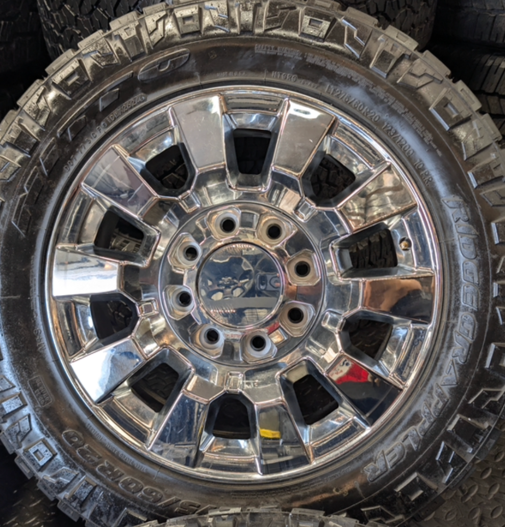 OEM 20” Chrome GMC Sierra Denali 2500HD / 3500HD Wheels wrapped in LT275/60R20 Nitto Ridge Grappler tires.